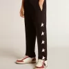 Pantaloni jogging neri da bambino con stelle bianche