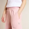 Pantaloni jogging rosa con stella glitterata sul davanti Pantaloni jogging rosa con stella glitterata sul davanti