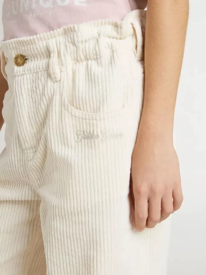 Pantaloni larghi a coste color crema con ricami per bambina Pantaloni larghi a coste color crema con ricami per bambina