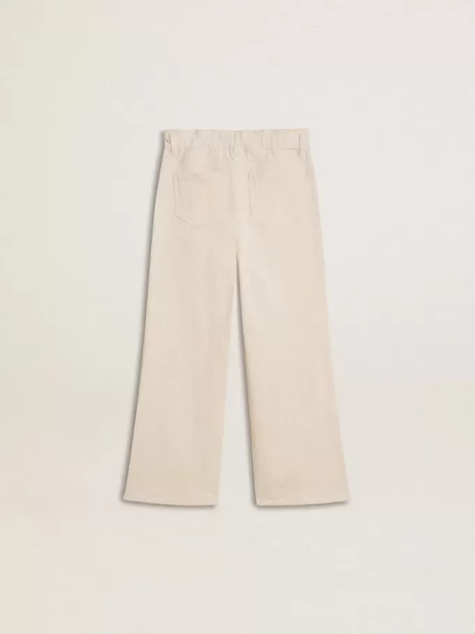 Pantaloni larghi a coste color crema con ricami per bambina Pantaloni larghi a coste color crema con ricami per bambina