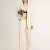 Pantaloni larghi da donna in tessuto sartoriale bianco consumato Pantaloni larghi da donna in tessuto sartoriale bianco consumato