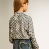 Polo da bambina con stampa geometrica Polo da bambina con stampa geometrica