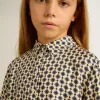 Polo da bambina con stampa geometrica Polo da bambina con stampa geometrica