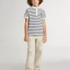 Polo da bambino in cotone bianco con strisce blu navy e ricami
