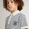 Polo da bambino in cotone bianco con strisce blu navy e ricami