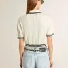 Polo da donna corta in cotone bianco consumato con bordi blu Polo da donna corta in cotone bianco consumato con bordi blu