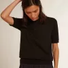 Polo da donna in lana merino nera Polo da donna in lana merino nera