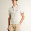 Polo da uomo in maglia traforata bianca con dettagli a righe bordeaux Polo da uomo in maglia traforata bianca con dettagli a righe bordeaux
