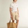 Polo da uomo in maglia traforata bianca con dettagli a righe bordeaux Polo da uomo in maglia traforata bianca con dettagli a righe bordeaux