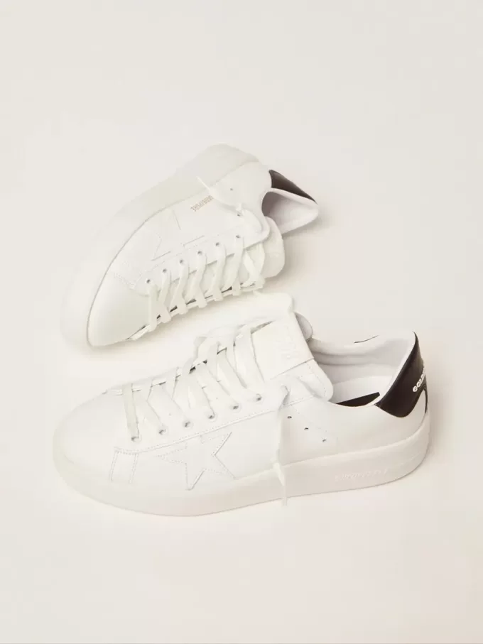 Purestar da donna con linguetta nera sul tallone Purestar da donna con linguetta nera sul tallone