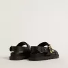 Sandalo Lucy da donna in pelle nera lucida con fibbia in metallo dorato