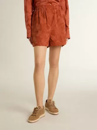 Shorts da donna in jacquard rosso mattone con motivo floreale marino