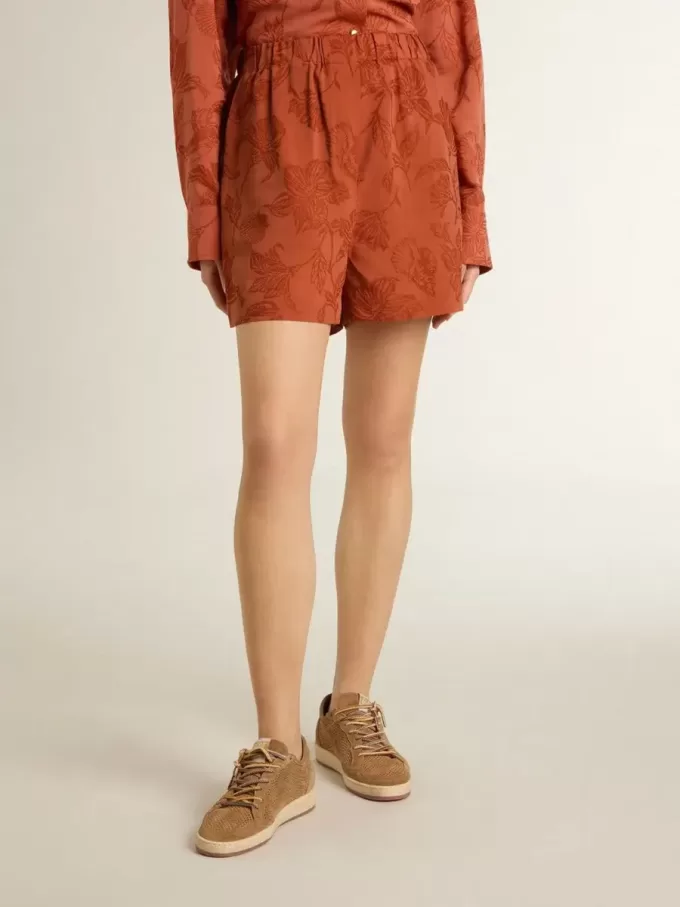 Shorts da donna in jacquard rosso mattone con motivo floreale marino