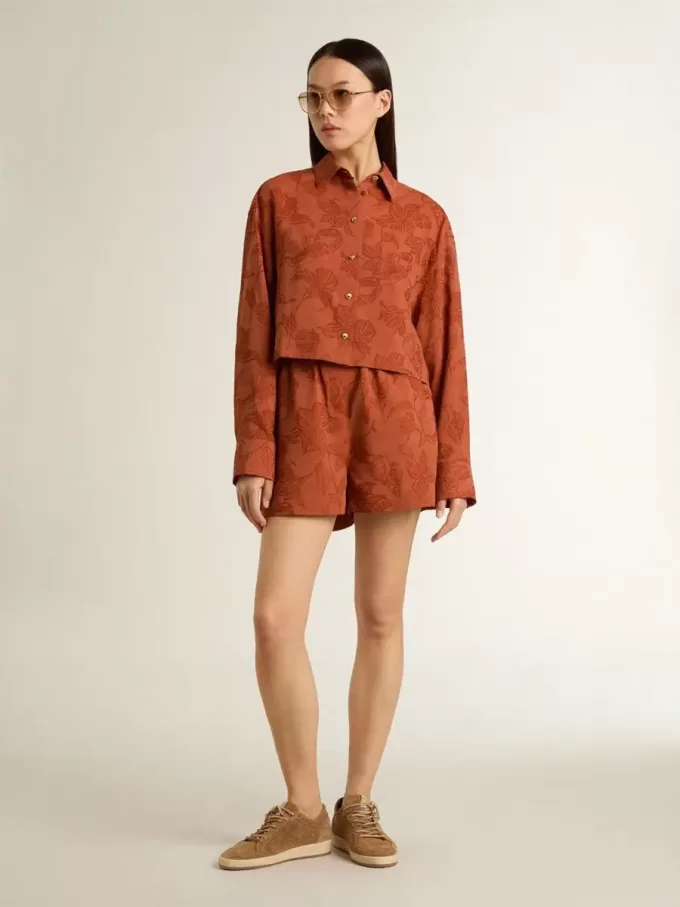 Shorts da donna in jacquard rosso mattone con motivo floreale marino