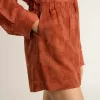 Shorts da donna in jacquard rosso mattone con motivo floreale marino