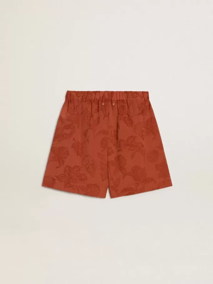 Shorts da donna in jacquard rosso mattone con motivo floreale marino