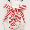 Skin “Playful” lacci a righe rosse e beige con charm applicati
