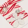 Skin “Playful” lacci a righe rosse e beige con charm applicati