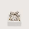 Skin Lacci a righe rosse e beige “Playful” con due charm applicati
