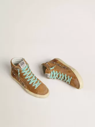 Slide da donna in pelle scamosciata color ocra con stella in pelle color tabacco Slide da donna in pelle scamosciata color ocra con stella in pelle color tabacco