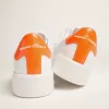 Sneakers Purestar bianche con linguetta sul tallone arancione fluorescente Sneakers Purestar bianche con linguetta sul tallone arancione fluorescente