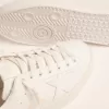 Sneakers Purestar da donna con linguetta dorata sul tallone Sneakers Purestar da donna con linguetta dorata sul tallone