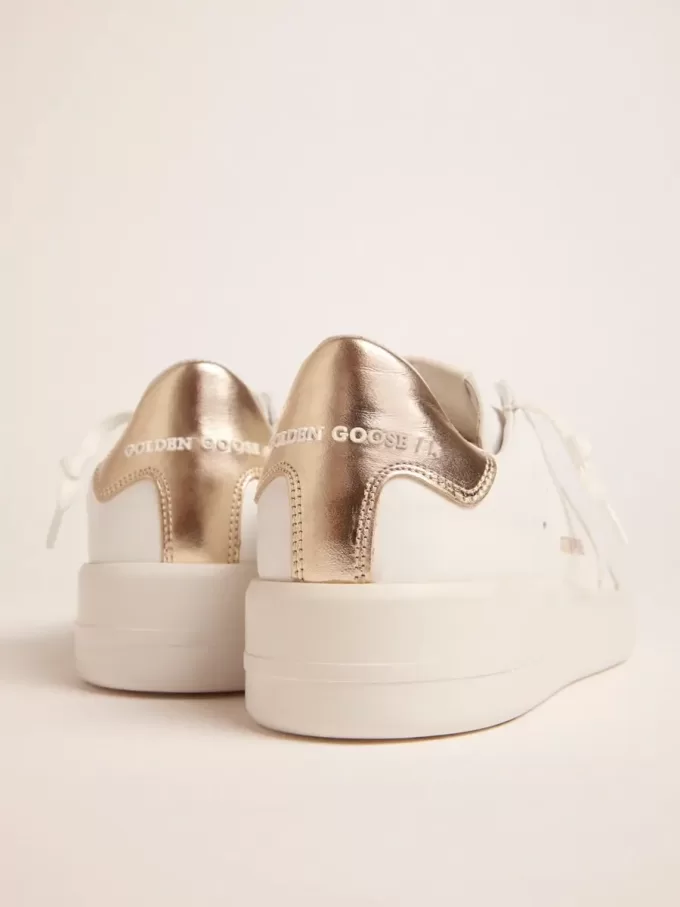 Sneakers Purestar da donna con linguetta dorata sul tallone Sneakers Purestar da donna con linguetta dorata sul tallone