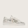 Stardan con stella e punta in pelle scamosciata beige e scritte e motivi su tutta la superficie Stardan con stella e punta in pelle scamosciata beige e scritte e motivi su tutta la superficie
