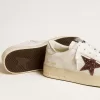 Stardan da donna in nappa con stella glitterata e linguetta sul tallone in pelle metallizzata Stardan da donna in nappa con stella glitterata e linguetta sul tallone in pelle metallizzata
