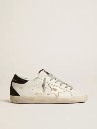 Super-Star da donna con stella dorata e tallone nero glitterato