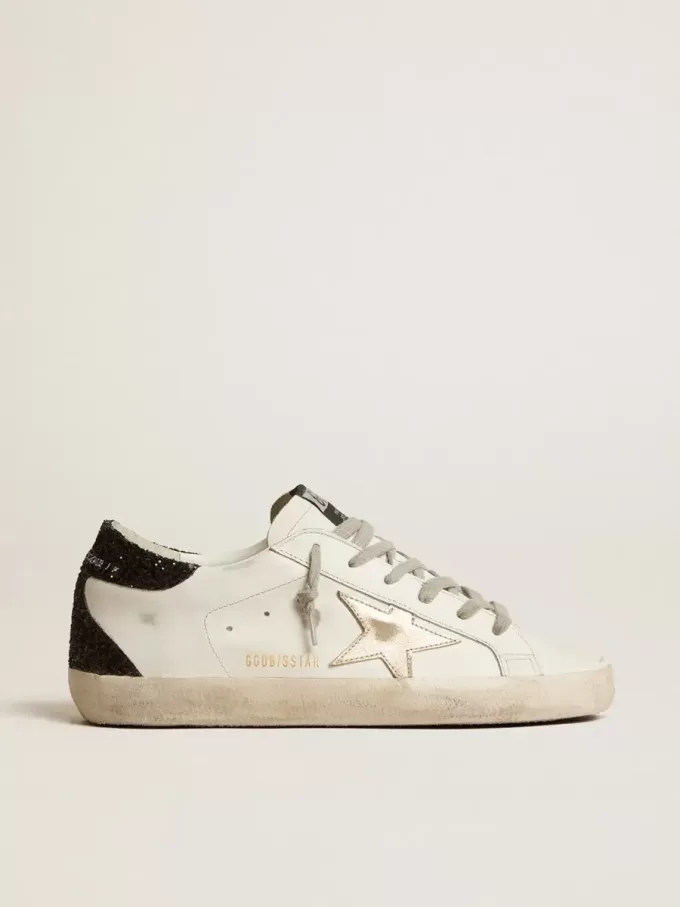 Super-Star da donna con stella dorata e tallone nero glitterato