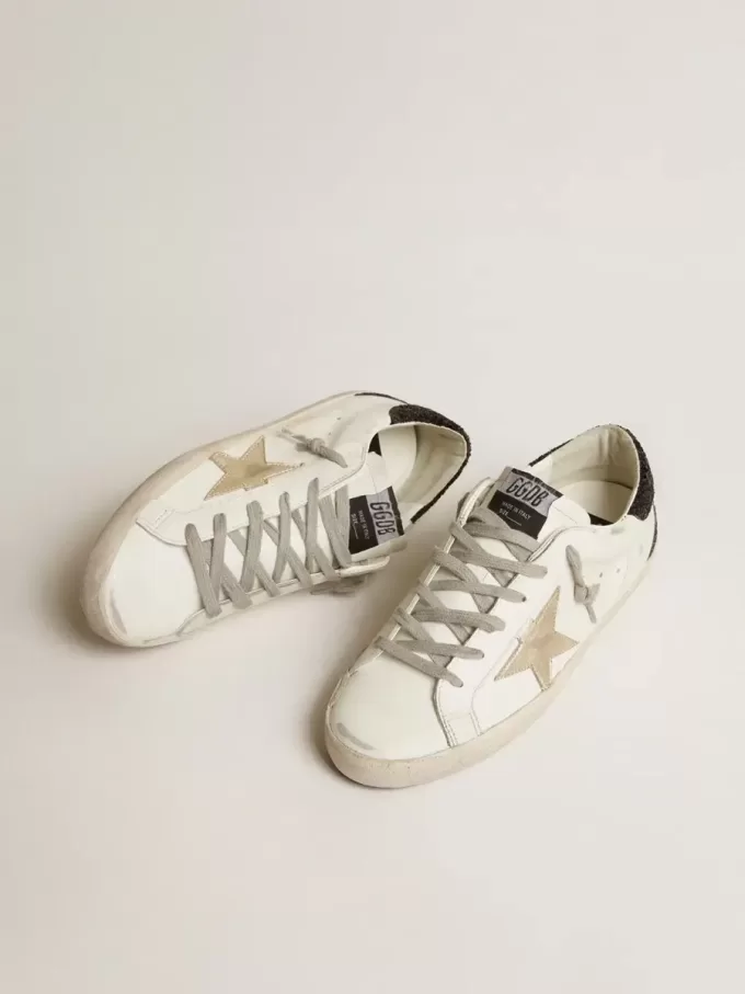 Super-Star da donna con stella dorata e tallone nero glitterato