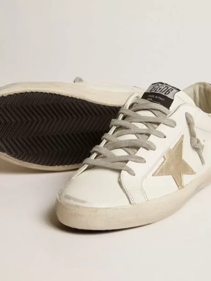 Super-Star da donna con stella dorata e tallone nero glitterato