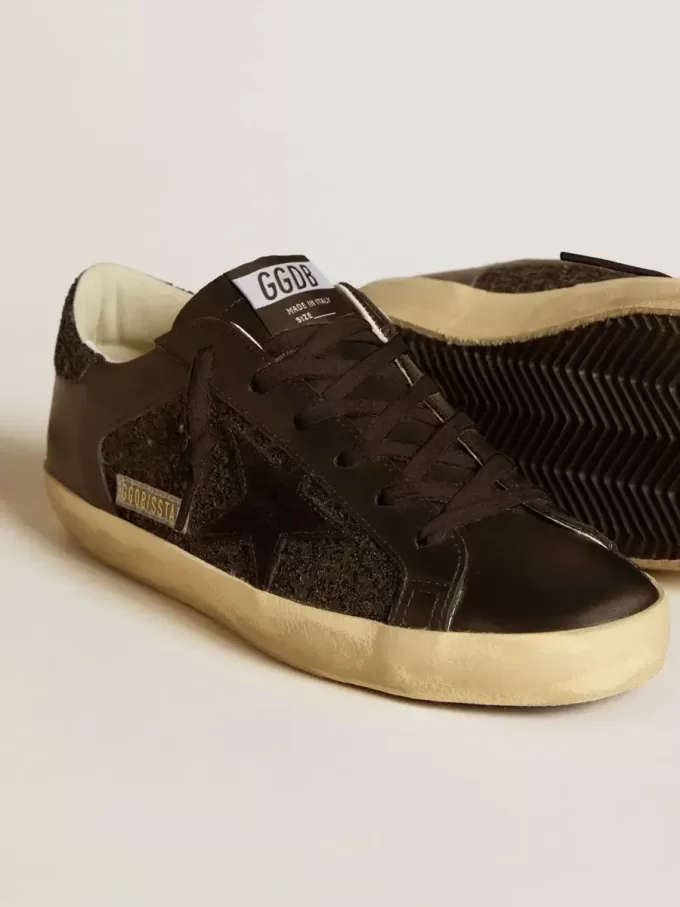 Super-Star da donna in glitter nero con stella in camoscio nero e inserti in pelle Super-Star da donna in glitter nero con stella in camoscio nero e inserti in pelle