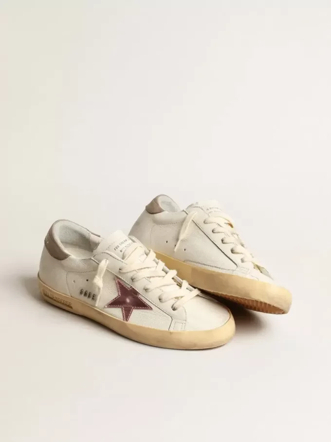Super-Star da donna in nappa bianca con stella in pelle metallizzata rosa