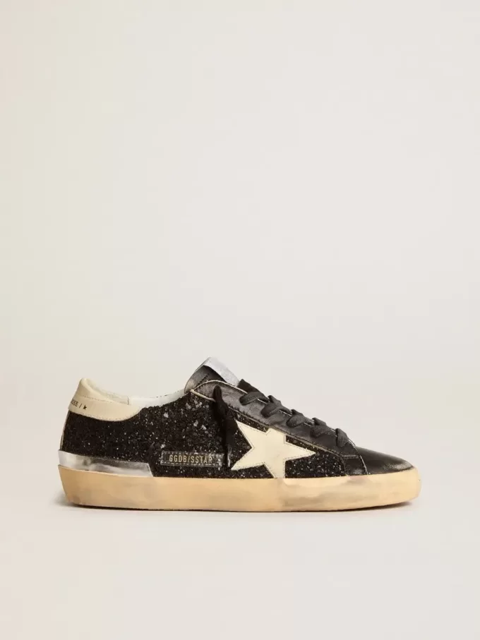 Super-Star da donna in nero glitterato e nappa con stella e tallone in pelle color crema Super-Star da donna in nero glitterato e nappa con stella e tallone in pelle color crema