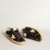 Super-Star da donna in nero glitterato e nappa con stella e tallone in pelle color crema Super-Star da donna in nero glitterato e nappa con stella e tallone in pelle color crema
