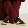 Super-Star da donna in nero glitterato e nappa con stella e tallone in pelle color crema Super-Star da donna in nero glitterato e nappa con stella e tallone in pelle color crema