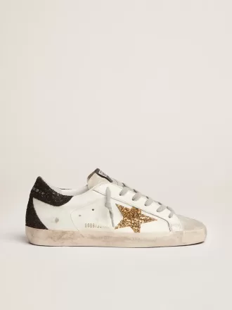 Super-Star da donna in pelle nappa con stella glitterata dorata e linguetta sul tallone glitterata nera Super-Star da donna in pelle nappa con stella glitterata dorata e linguetta sul tallone glitterata nera