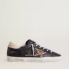 Super-Star da donna in pelle nappa nera con stella in pelle di cavallino con stampa zebrata e linguetta sul tallone in pelle beige Super-Star da donna in pelle nappa nera con stella in pelle di cavallino con stampa zebrata e linguetta sul tallone in pelle beige