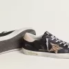 Super-Star da donna in pelle nappa nera con stella in pelle di cavallino con stampa zebrata e linguetta sul tallone in pelle beige Super-Star da donna in pelle nappa nera con stella in pelle di cavallino con stampa zebrata e linguetta sul tallone in pelle beige