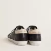 Super-Star da donna in pelle nappa nera con stella in pelle di cavallino con stampa zebrata e linguetta sul tallone in pelle beige Super-Star da donna in pelle nappa nera con stella in pelle di cavallino con stampa zebrata e linguetta sul tallone in pelle beige