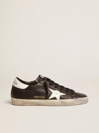 Super-Star da donna in pelle nera con stella e linguetta sul tallone in pelle bianca Super-Star da donna in pelle nera con stella e linguetta sul tallone in pelle bianca
