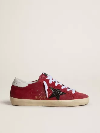 Super-Star da donna in pelle scamosciata rossa con stella glitterata e tallone bianco Super-Star da donna in pelle scamosciata rossa con stella glitterata e tallone bianco