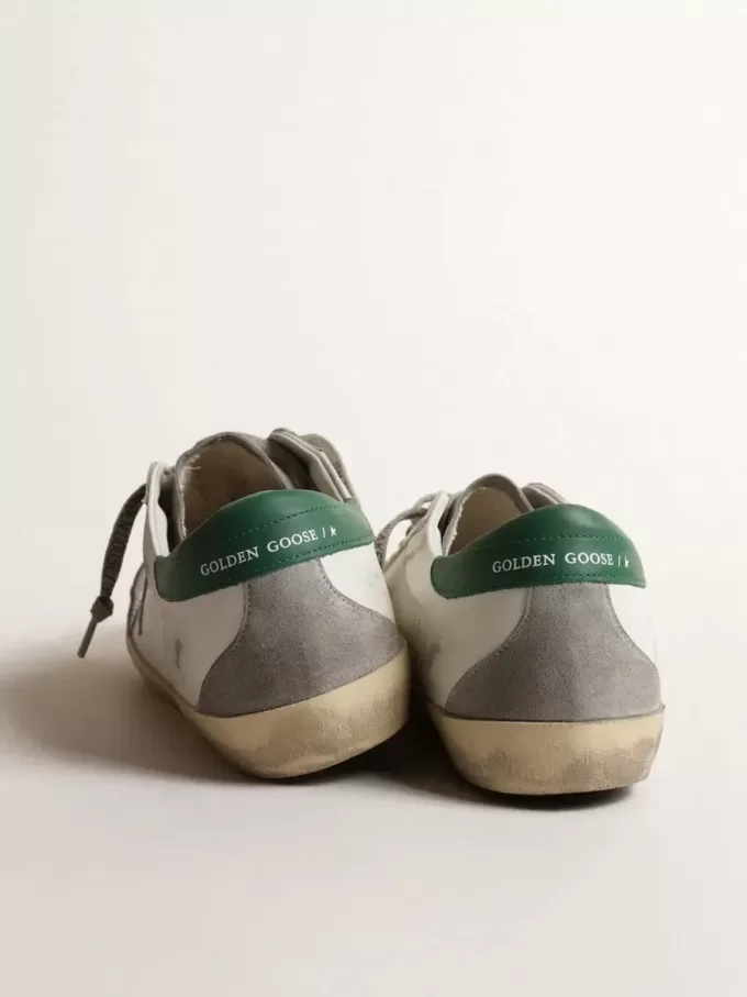 Super-Star da uomo in pelle bianca con stella argentata e linguetta verde sul tallone