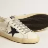 Super-Star da uomo in pelle bianca con stella in tela blu notte e linguetta sul tallone in pelle tabacco Super-Star da uomo in pelle bianca con stella in tela blu notte e linguetta sul tallone in pelle tabacco