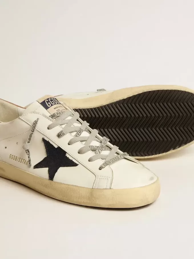 Super-Star da uomo in pelle bianca con stella in tela blu notte e linguetta sul tallone in pelle tabacco Super-Star da uomo in pelle bianca con stella in tela blu notte e linguetta sul tallone in pelle tabacco