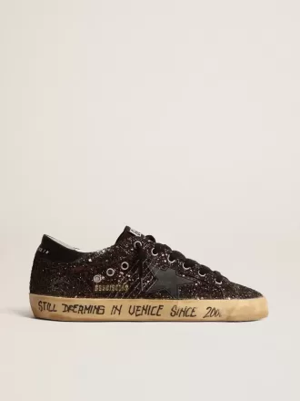 Super-Star in marrone glitterato con stella e linguetta sul tallone in pelle nera Super-Star in marrone glitterato con stella e linguetta sul tallone in pelle nera