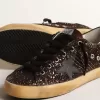 Super-Star in marrone glitterato con stella e linguetta sul tallone in pelle nera Super-Star in marrone glitterato con stella e linguetta sul tallone in pelle nera