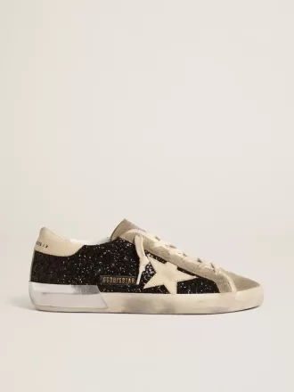 Super-Star in nero glitterato con stella color crema e inserti in pelle scamosciata Super-Star in nero glitterato con stella color crema e inserti in pelle scamosciata